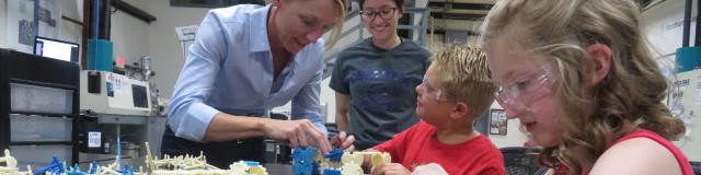 Mary Key guiding students through a hands-on 3D-printing project in a maker lab